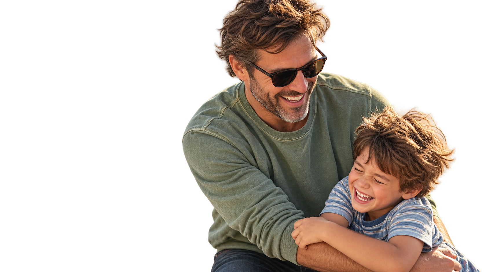 A father and son laughing together in a playful hug.